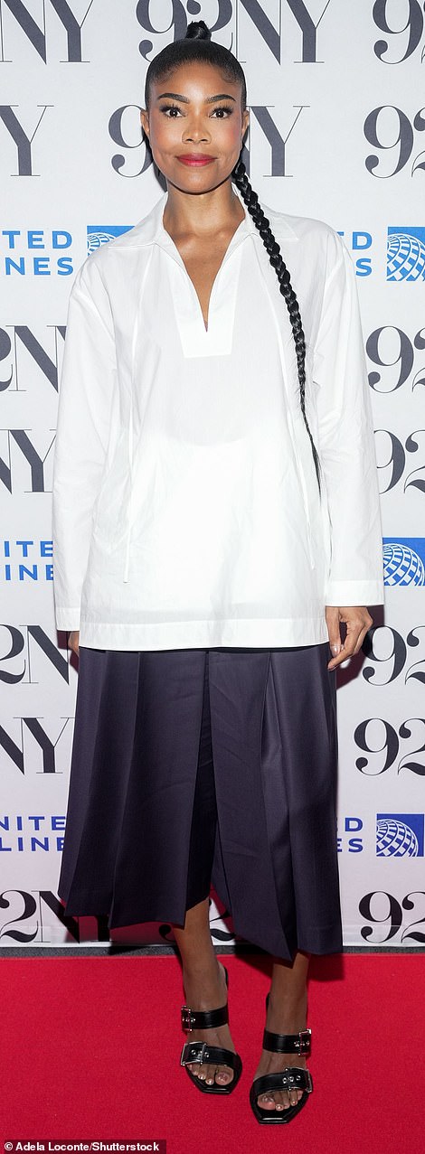 Gabrielle, 51, modeled a white tunic with wide-leg pleated black shorts.