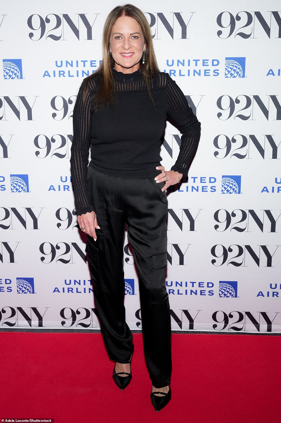 Producer Cathy Schulman went for an all-black look that included a sheer ribbed sweater and pants with a shiny finish.