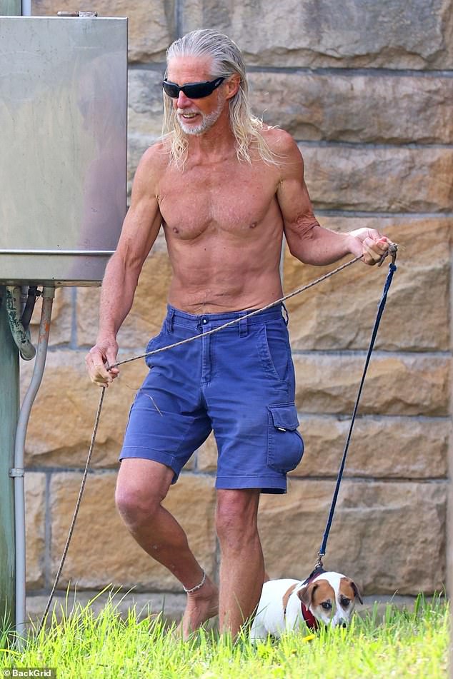 The 70-year-old, known for his cult films Young Einstein (1988) and Reckless Kelly (1993), showed off his impressive abs in shorts.
