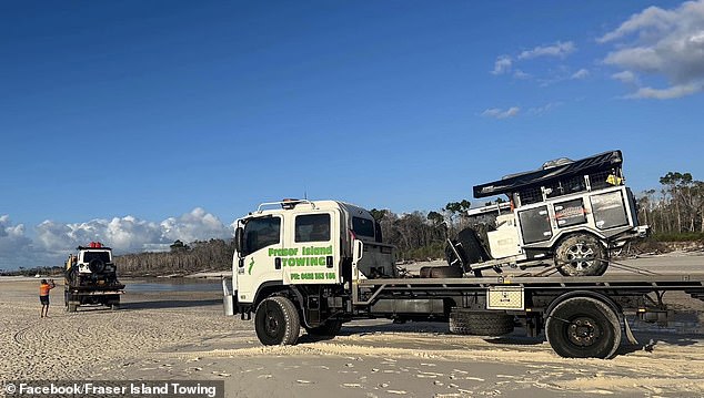 The rescued Jeep was loaded onto the back of a tilt-tray crane and the camper onto a second truck, before being driven off the beach.