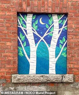 One of the other murals depicts a night scene of two trees.