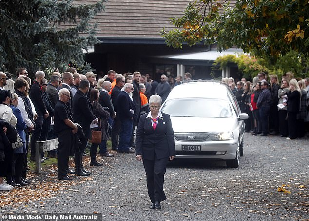 Mourners say goodbye to Hannah McGuire at the end of the service