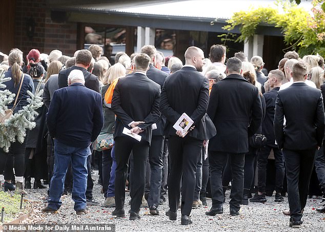 Mourners were forced to remain outside the chapel to listen to the service.