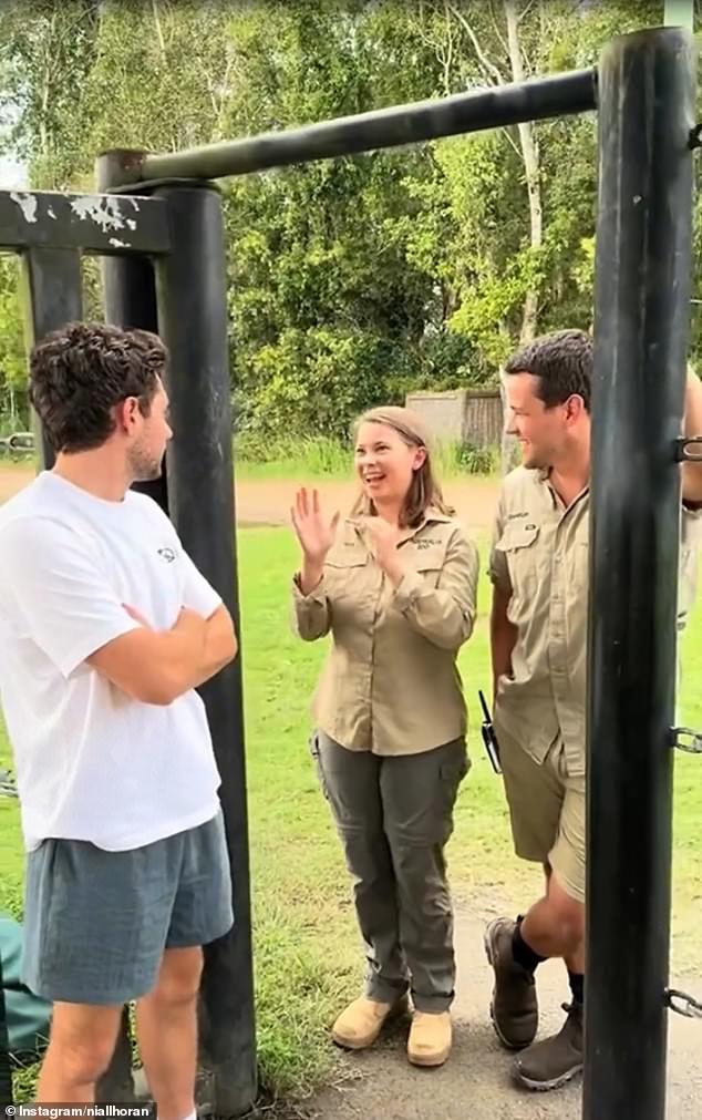 The singer (left) was also seen chatting with Bindi Irwin, 25, (center) and her husband of four years, Chandler Powell, 27 (right).