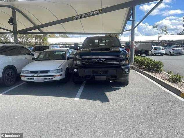 A giant American ute is shown taking up more parking space than it is allotted.