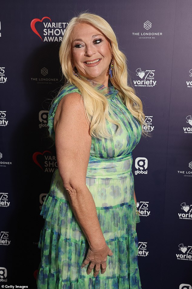 The broadcaster, 62, couldn't wipe the cheerful smile from her face as she made an elegant entrance for the dazzling evening held at The Londoner Hotel, stunning in a long green printed sleeveless dress, cinched at the waist and with a tiered skirt .
