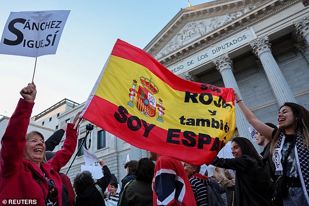 People march to show their support for Spain's Prime Minister Pedro Sánchez in Madrid, Spain, on April 28.