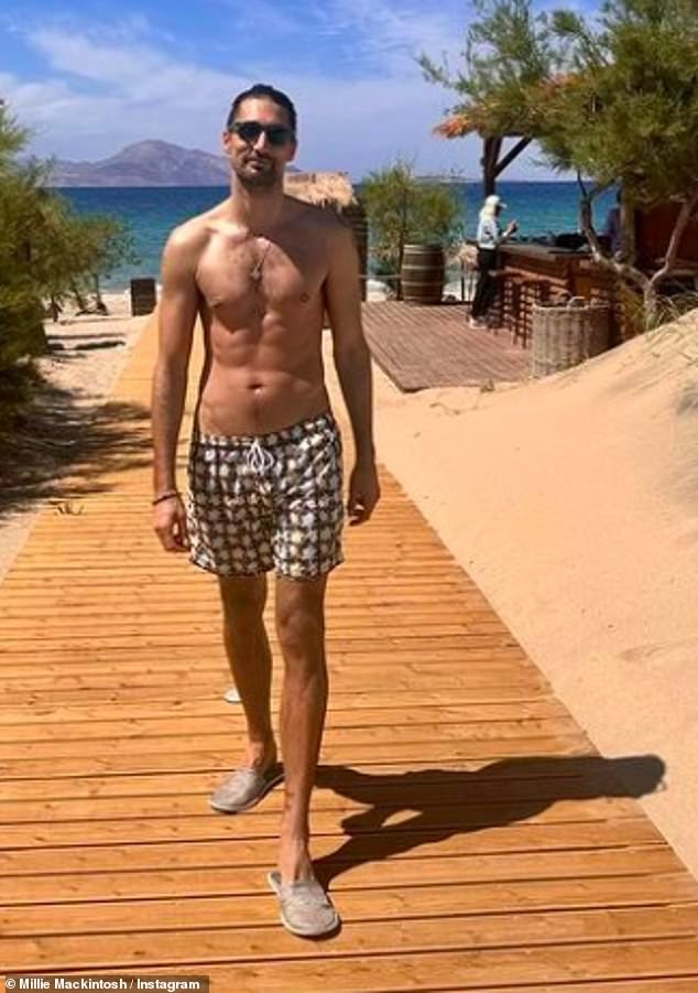 She also shared a photo of her handsome husband Hugo, who was wearing printed swim shorts on the beach.