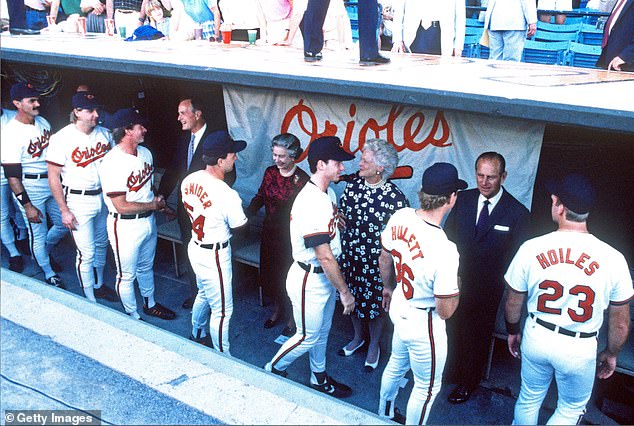 Members of the Baltimore Orioles baseball team meet with Queen Elizabeth, Prince Philip, and President George W. Bush and first lady Barbara Bush during a May 1991 visit to Memorial Stadium, the predecessor of Camden Yards.