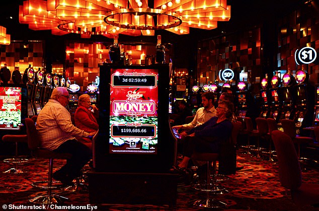 Crown chief executive Ciaran Carruthers said the firm is committed to implementing a series of regulatory measures to help reduce problem gambling (customers pictured at a Crown casino).