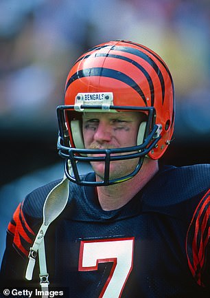 Quarterback Boomer Esiason #7 of the Cincinnati Bengals looks on from the sideline during a game against the New York Giants at Riverfront Stadium on October 13, 1985 in Cincinnati, Ohio.  The Bengals defeated the Giants 35-30
