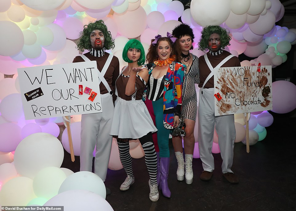 Paterson was joined by a cast of other deranged-looking Oompa Loompas carrying signs demanding 