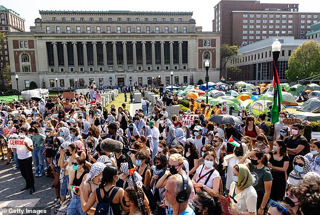 Pro-Palestinian protesters hold a brief demonstration after marching around the 'Gaza Solidarity Camp' on the West Lawn of Columbia University on Monday.  Protesters marched at Columbia University as the 2 p.m. deadline to clear the encampment granted to students by the university passed.