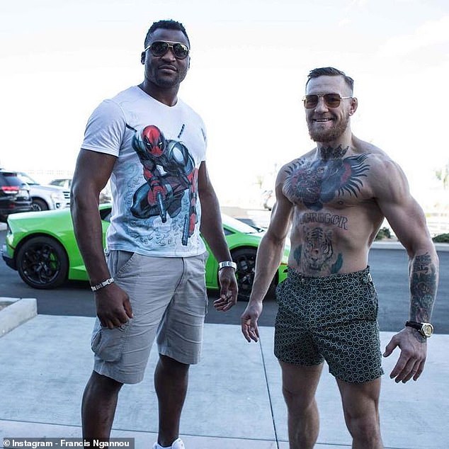 Fellow MMA star McGregor (right) is a father of four and sent his prayers to Ngannou.