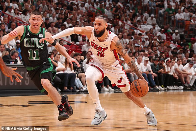 Caleb Martin of the Heat drives to the basket against Payton Pritchard of the Celtics in Game 4