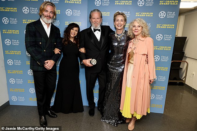 Pine and Stone also posed with the Oscar-winning man of the moment (M) on the black carpet alongside fellow speaker Rosie Perez (2-L) and Blythe Danner (R).