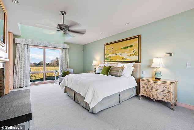 Shown here is one of three spacious bedrooms with views of the nearby fields.