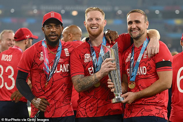 Jordan, Ben Stokes and Liam Livingstone with the trophy after England's World Cup victory