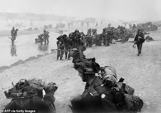 British troops take up positions on Sword Beach during D-Day, June 6, 1944, after Allied forces storm the beaches of Normandy.