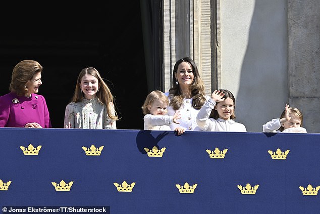 Princess Estelle smiles for the cameras as she talks to her grandmother, Queen Silvia.