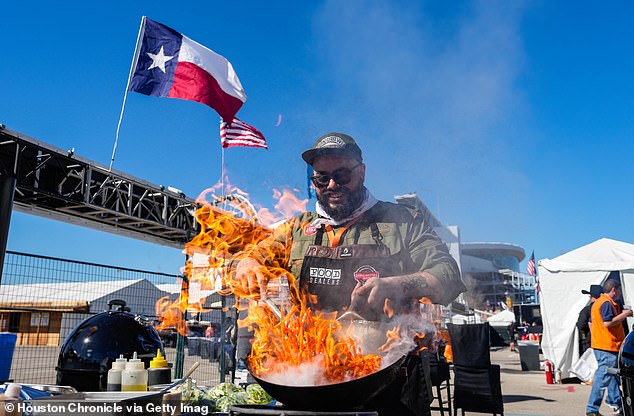 Barbecue is an essential part of Southern life, Andrew writes.  Pictured: A chef prepares a dish at the Houston World Championship Rodeo and Livestock Show Bar-B-Que contest in February.