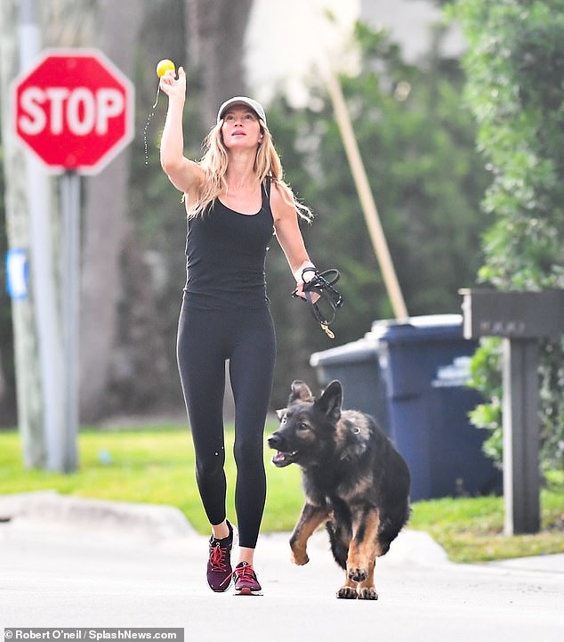 While doing a quick morning workout, the supermodel, 43, looked chic and sporty in an all-black workout, which consisted of a tight-fitting tank top, leggings, and pink lace-up sneakers.