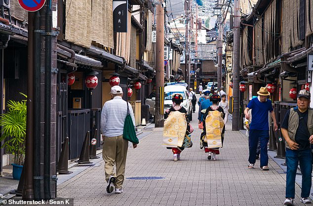 Sandy said Japan has banned tourists from walking certain alleys in Gion, Kyoto's Geisha district, due to poor tourist behavior (pictured in Gion).