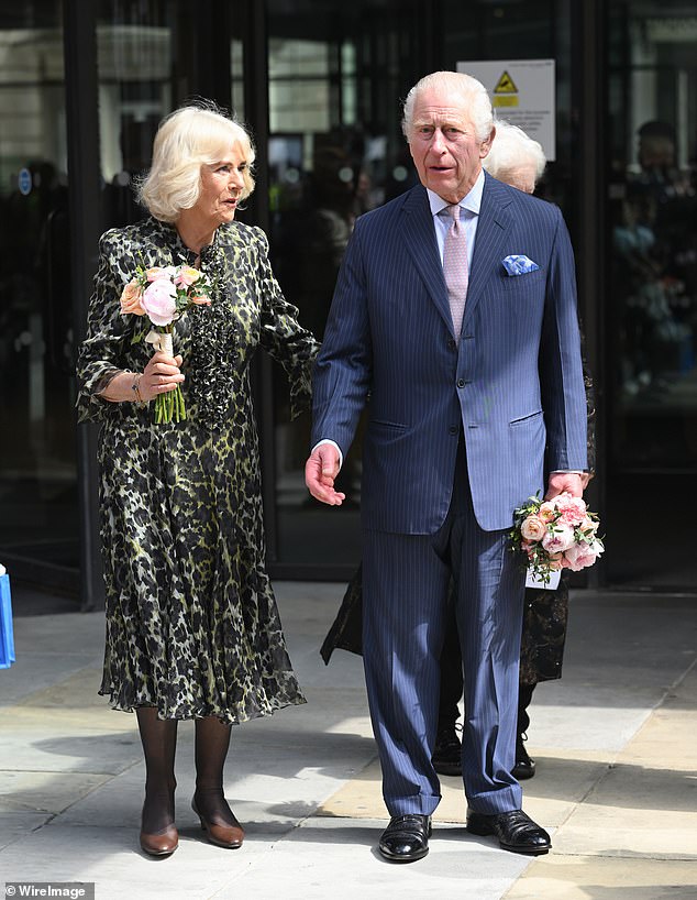 Camilla gently urged Charles back to the car while he enjoyed greeting well-wishers.