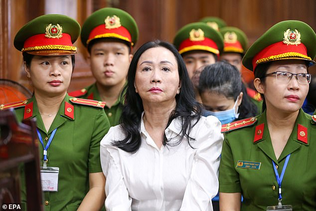 Truong My Lan (center), chairwoman of Van Thinh Phat Holdings, sits during her trial at the People's Court in Ho Chi Minh City.
