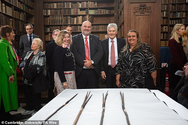 (LR)Elisabeth Bowes, Leonard Hill, Stephen Smith and Noeleen Timbery with four Aboriginal spears that were brought to England by Captain James Cook more than 250 years ago and have now been repatriated to Australia in a ceremony at Trinity College, Cambridge.