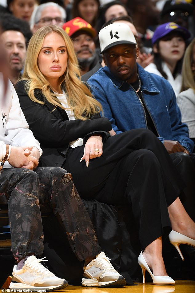 Adele, 35, brought some glamor to the NBA on Saturday night.  She stunned in a black and white ensemble as she and her husband Rich Paul, 43, watched the Los Angeles Lakers beat the Denver Nuggets 119-108 at Crypto.com Stadium.