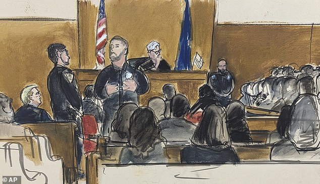 Former President Donald Trump, seated far left, watches with Judge Juan Merchan presiding as members of the jury panel answer jury questionnaire questions in Manhattan Criminal Court on Thursday.
