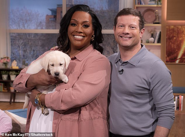 Alison Hammond with her This Morning co-presenter Dermot O'Leary. A member of the For The Love of Dogs team claimed that Ms Hammond is afraid of the biggest dogs on the show.