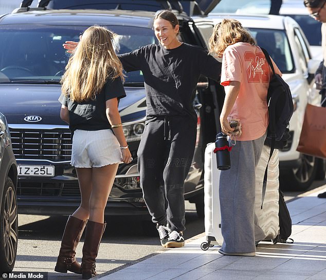 Bec Hewitt, 40, was seen saying a sweet goodbye to her eldest daughter Mia, 18, at Sydney Airport on Sunday as she embarked on a trip with her youngest daughter Ava, 13.  All photos