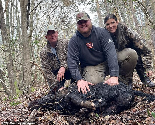 Moseley also shared a photo of himself, his father, and his girlfriend smiling as they pose with a dead pig, which appears to be the same animal in the video.