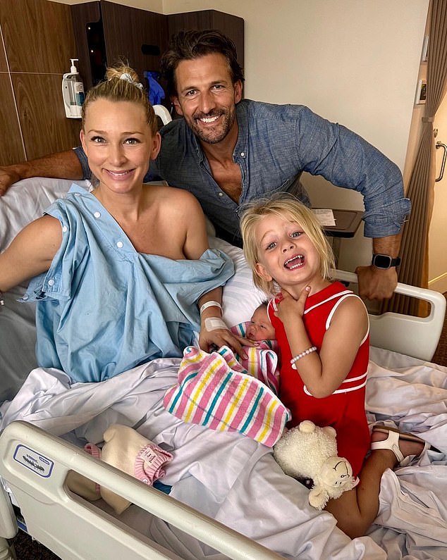 Bachelo's Anna Heinrich has revealed that she recently faced a life-threatening situation during the birth of her second daughter, Ruby.  She is pictured with her husband Tim Robards, 41, and her eldest daughter Elle, two.