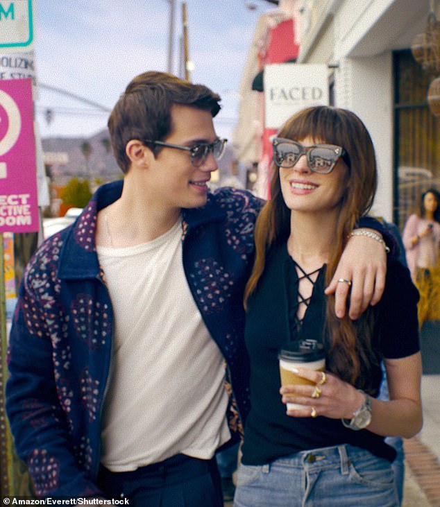 Anne Hathaway (right) has been responding to claims that the pop star character in her new romantic comedy The Idea of ​​You was inspired by Harry Styles.  Anne's character, Solène, begins a romance with boyband member Hayes Campbell, played by Nicholas Galitzine (left)