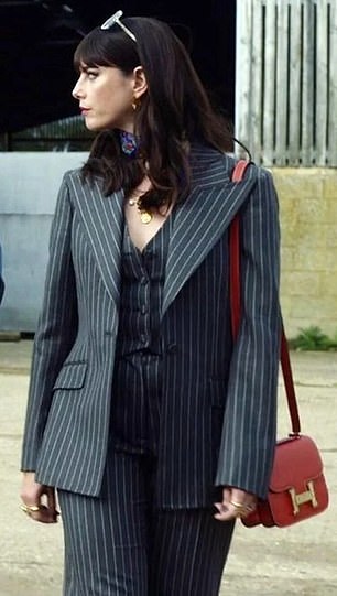 Susie Glass's gray striped three-piece suit is from Dolce & Gabbana: jacket, £1,800;  trousers, £725;  and vest £525