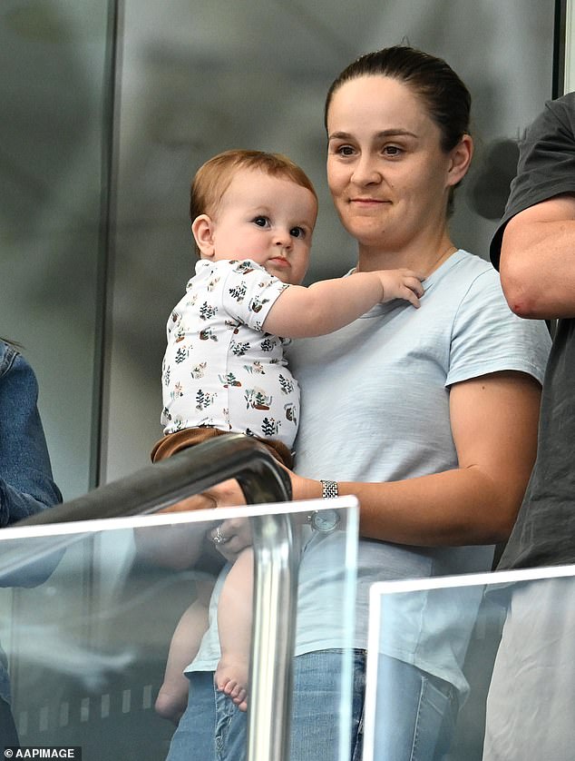 Ash Barty looked every inch the doting mother on Saturday as she took her nine-month-old son Hayden to watch the Billie Jean Cup at Brisbane's Pat Rafter Arena.  Both in the photo