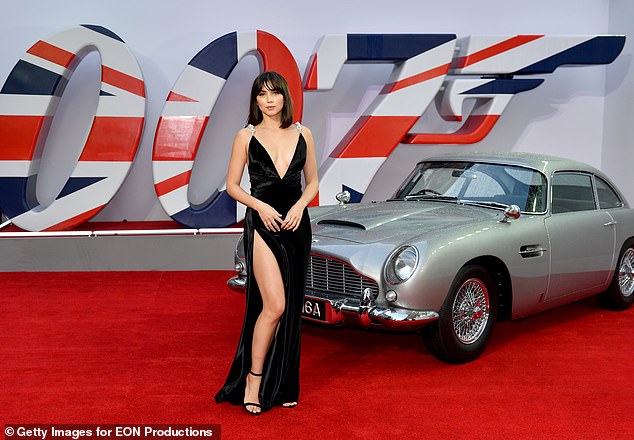 Making her mark: Bond girl Ana De Armas next to 007's Aston Martin car at the premiere of No Time To Die