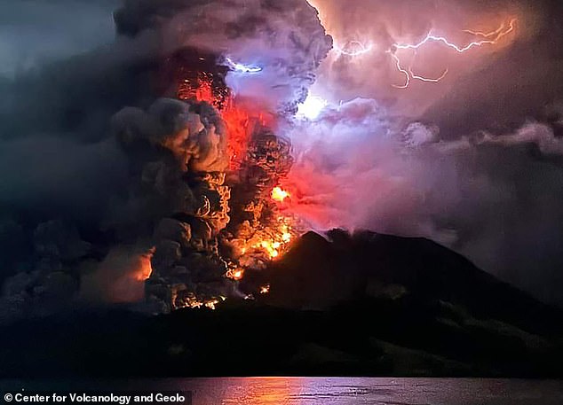 Australia is on tsunami alert after the Indonesian stratovolcano Mount Ruang (pictured) in North Sulawesi province spectacularly erupted five times in 24 hours.