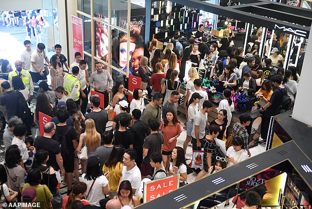 Australia has reached a new immigration milestone with the arrival of more than 100,000 foreigners in just one month for the first time (pictured, shoppers at Sydney's Pitt Street shopping centre).