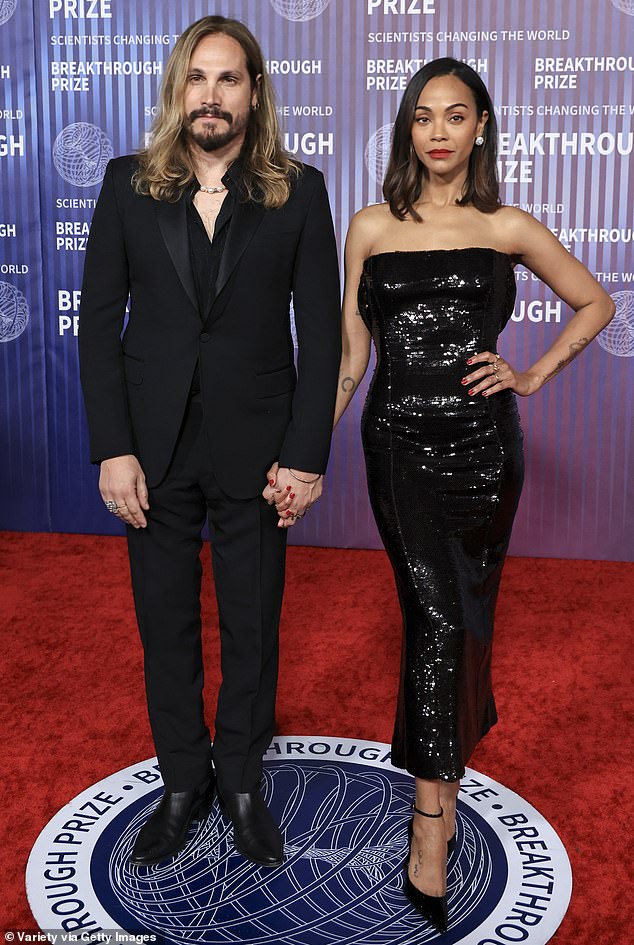Zoe Saldana and her husband of eleven years, Marco Perego, stunned in matching black ensembles at the 10th annual Breakthrough Prize event on Saturday night in Los Angeles.