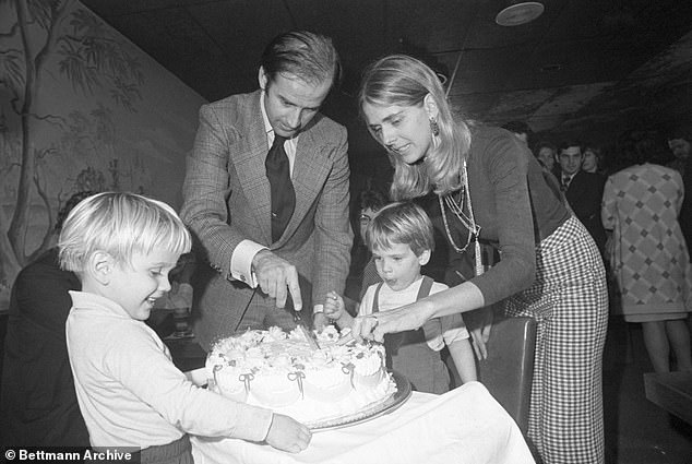 In this file image, Senator-elect Joseph Biden and his wife Nelia cut his 30th birthday cake at a party in Wilmington on November 20, 1972, with their two sons Hunter and Beau.
