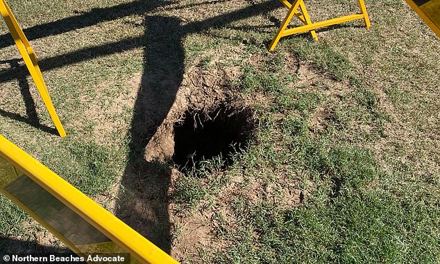 A teenager is lucky to be alive after becoming trapped in a sinkhole (pictured) at a family park.