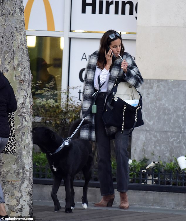 Brad Pitt's girlfriend, Ines-Olivia de Ramon, lit up a cigarette while talking on the phone and walking her beloved rescue dog Gregory, aka 'Greggy,' near the Santa Monica Pier on Wednesday.