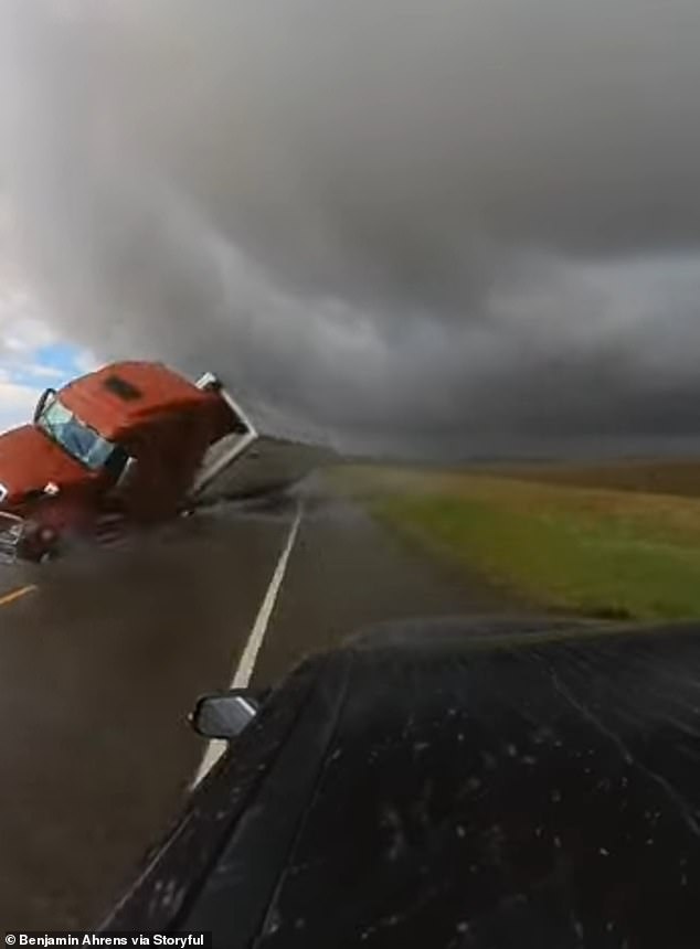 Footage from Friday in Nebraska shows the moment a truck collided with a vehicle during another tornado.