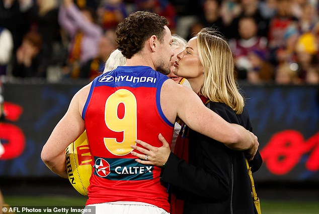 Lachie Neale and his wife Jules were on the MCG pitch on Thursday night.
