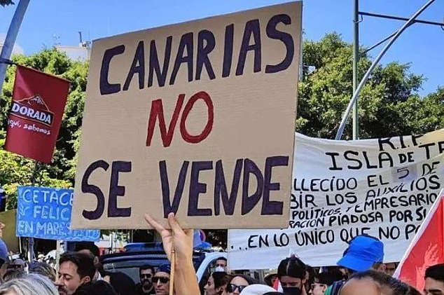 Anti-tourism protests are planned to take place in the Canary Islands of Tenerife, Fuerteventura, Gran Canaria, Lanzarote and La Palma on April 20 (sign says: Canary Islands not for sale)