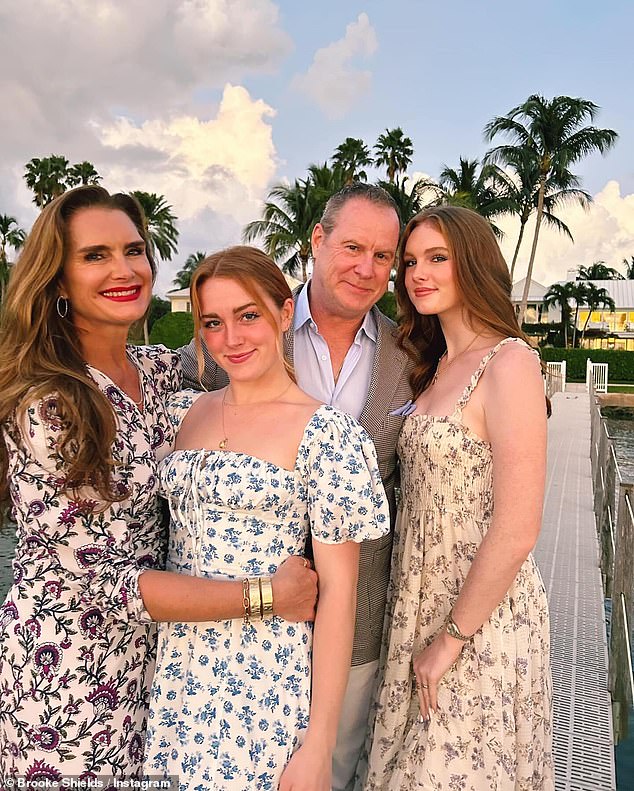 A family portrait featuring Brooke, her husband Chris and their two daughters.